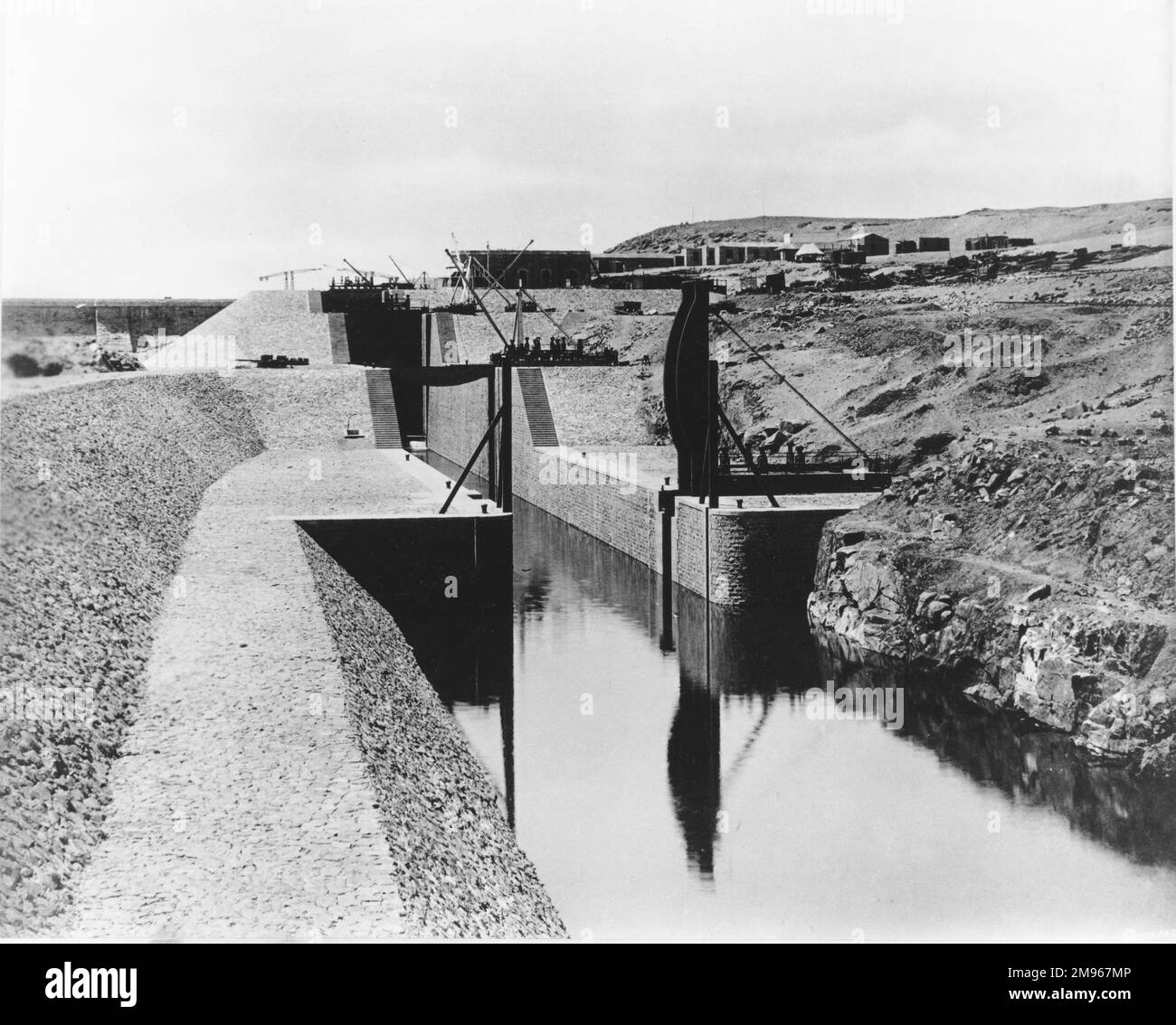 The Aswan Dam (the old or low dam) on the River Nile in Egypt: entrance to locks, downstream. Stock Photo