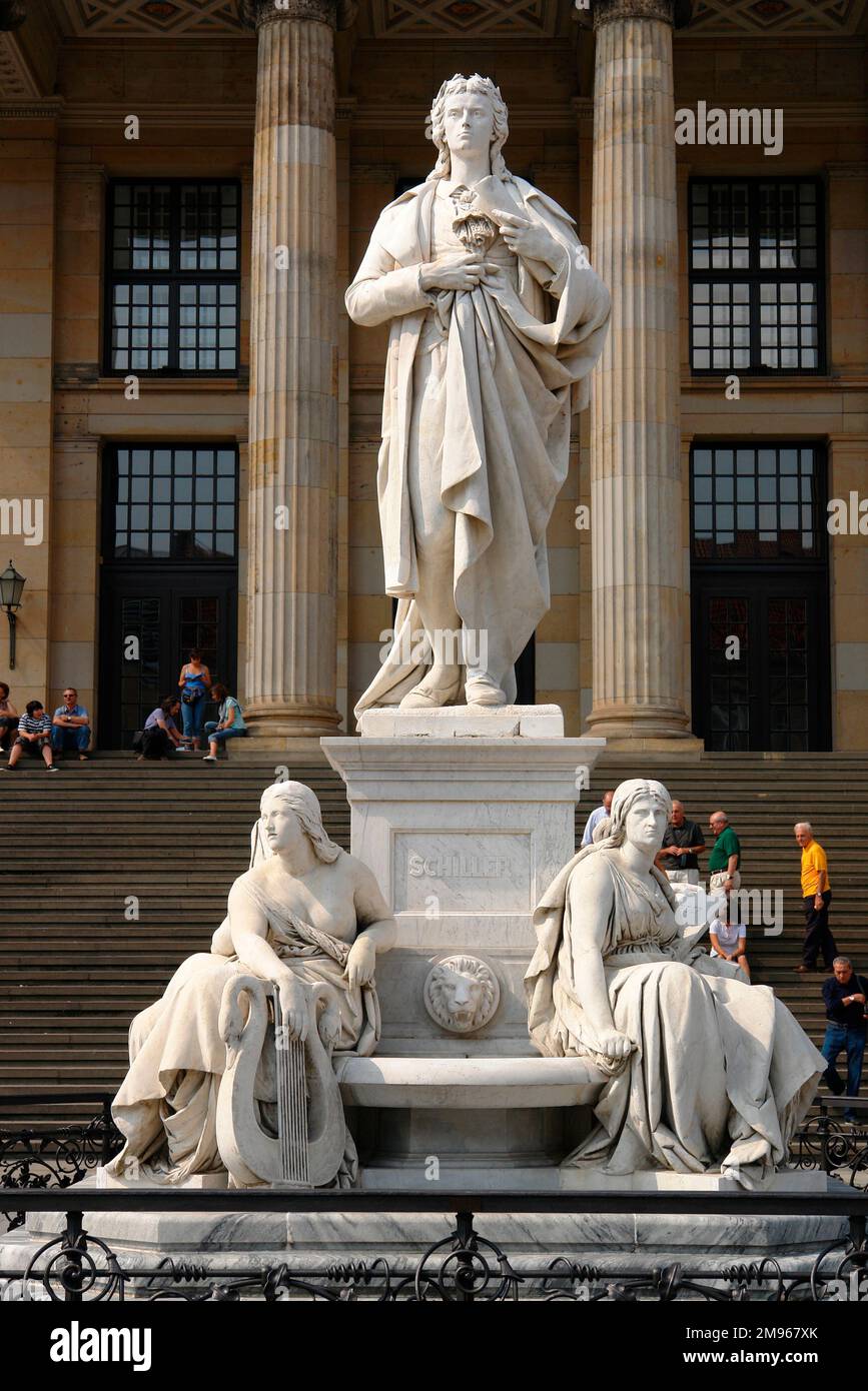 The memorial to Friedrich von Schiller in front of the theatre and concert hall in the Gendarmenmarkt, Berlin, Germany. Stock Photo