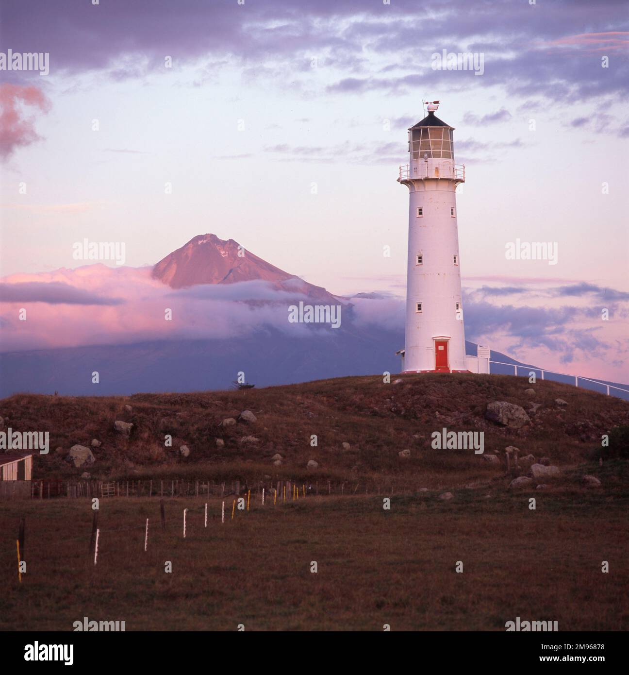 Cape Egmont lighthouse, with Mount Egmont (Mount Taranaki) in the