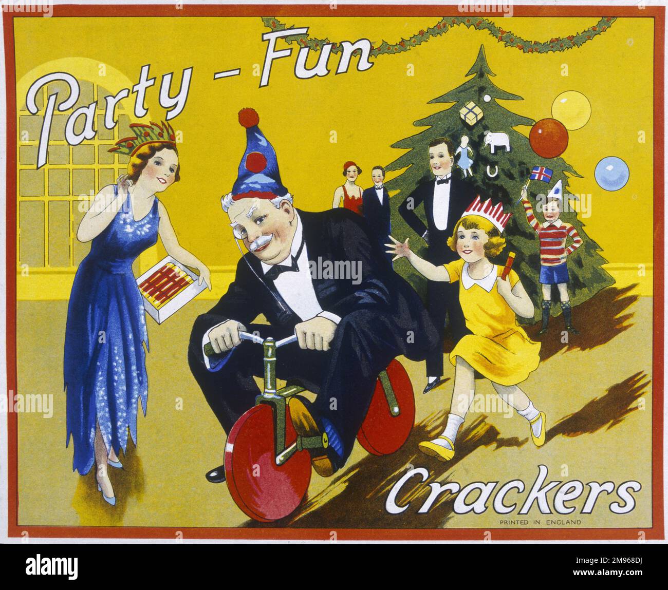 Label from a box of Party Fun Christmas crackers showing a group of excitable children pchasing after an old uncle on a little bicycle. Stock Photo
