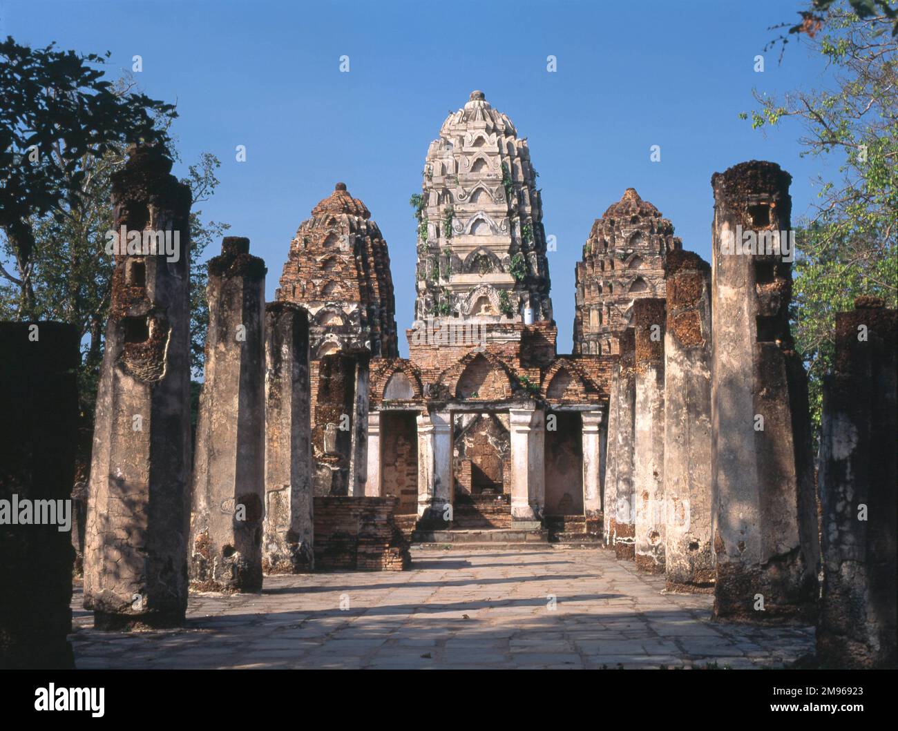 View of Wat Sri Sawai, a small Buddhist temple with three prangs in Old