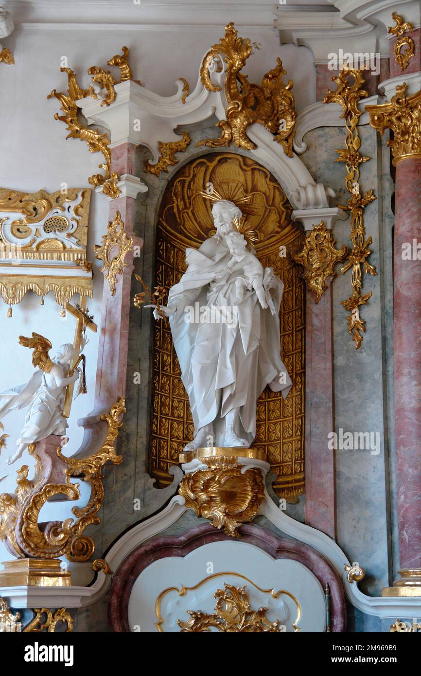 Detail of a statue in a niche in the ornate rococo Golden Hall (Goldener Saal) of the Academy for Teacher Training and Personnel Management, Dillingen an der Donau, Bavaria, Germany. The decorations were made in the 18th century, and the room was used for meetings and prayers. It is now used for concerts and other events. Stock Photo