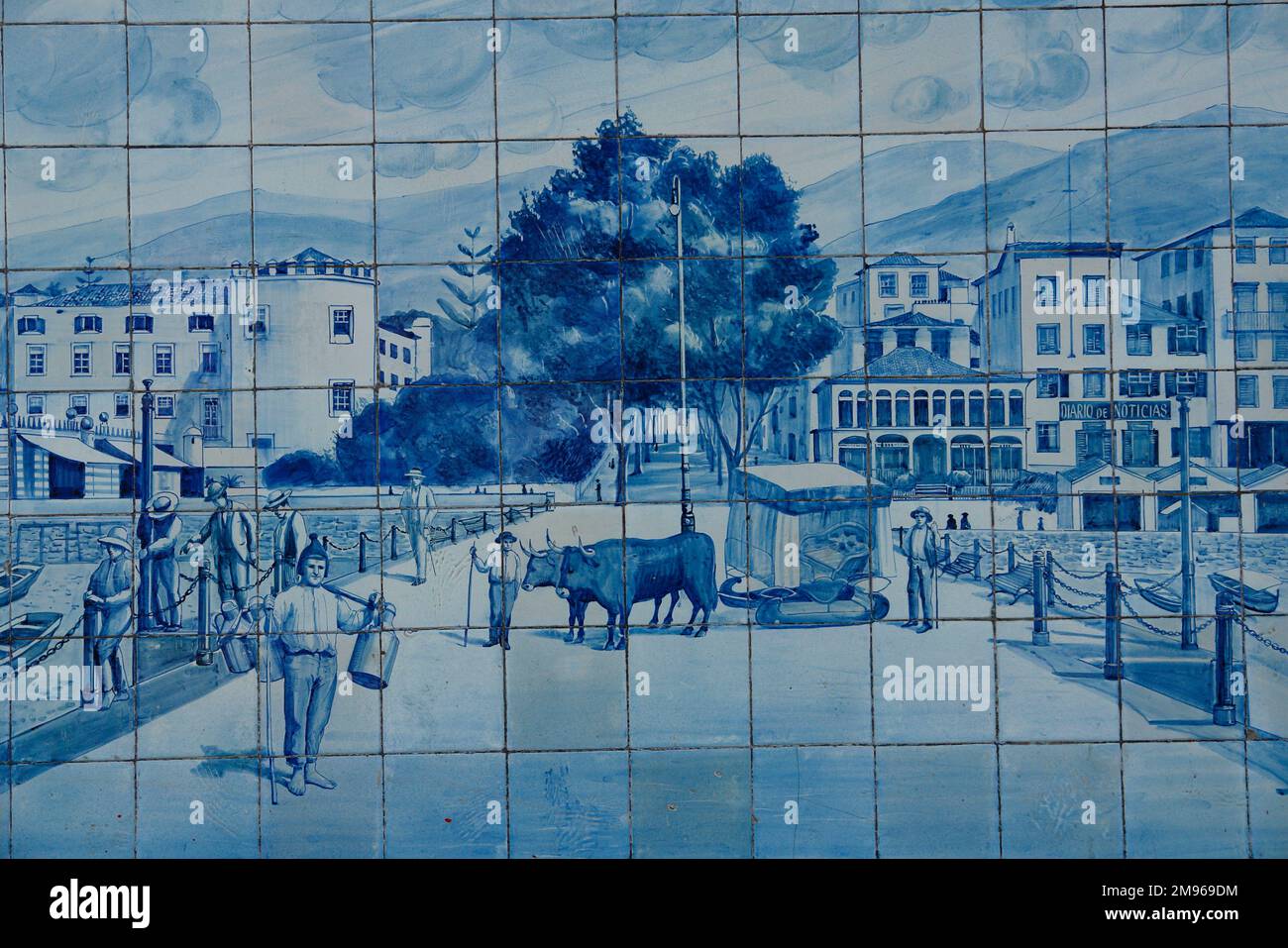 A picture on blue tiles outside the former Ritz Cafe, in the Avenida Arriaga in Funchal, Madeira, Portugal. This type of traditional design, on blue and white tin-glazed ceramic tiles, is known in Spain and Portugal as azulejo or azulejos. Stock Photo