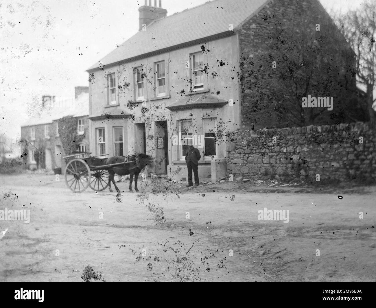 View of the main street and shop in St Davids, Pembrokeshire, Dyfed, South Wales. A man stands