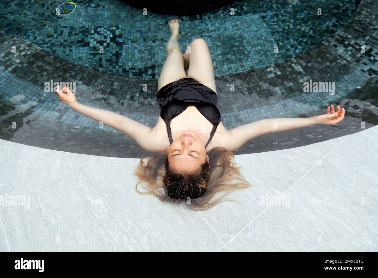 Saint-Gervais Mont-Blanc thermal spa. Balneotherapy.  Woman  enjoying spa and wellness treatment.  Relaxation concept.  France. Stock Photo