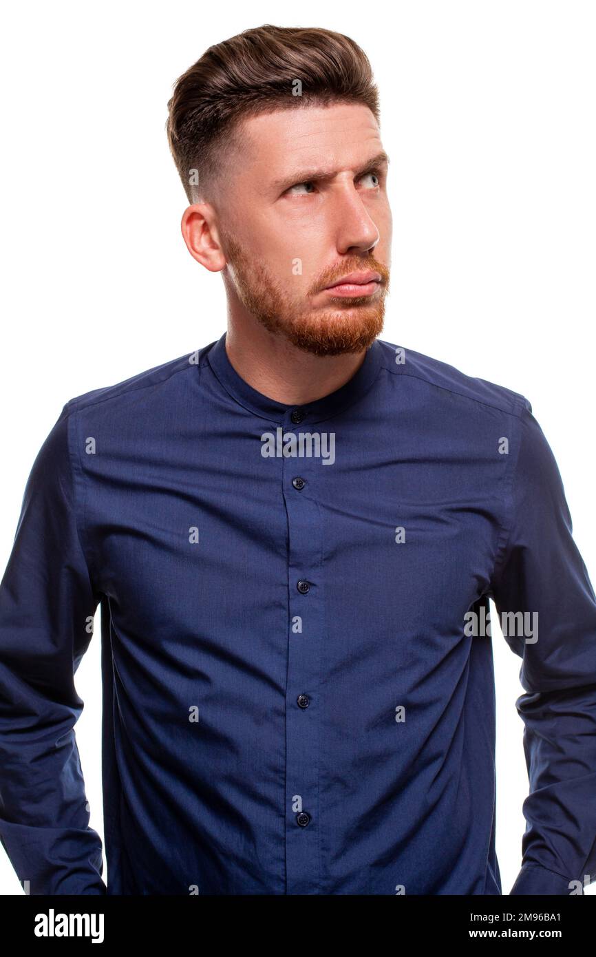 Attractive young man wearing blue shirt, isolated over a white background. Stock Photo