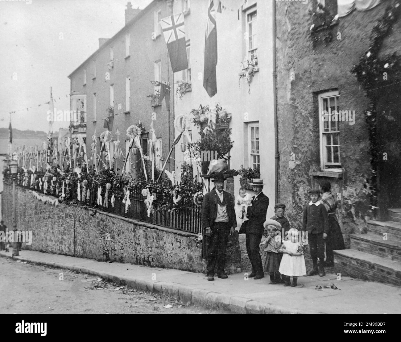 Scene in Gloucester Terrace, The Holloway, Haverfordwest, Pembrokeshire, South Wales, decorated with flags and bunting to celebrate the coronation of King Edward VII.  The houses belonged to the Great Western Railway (and before that to the South Wales Railway). Stock Photo