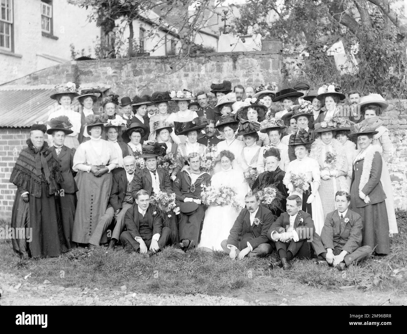 A large group photo of a Navy wedding in Crickhowell, Powys, Mid Wales