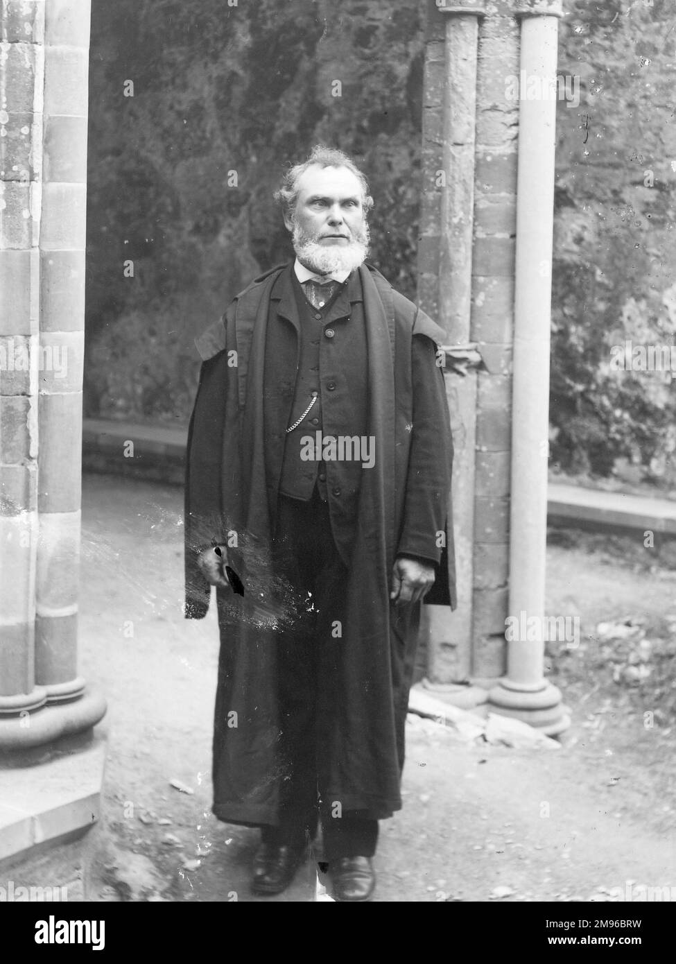 A rather ferocious looking Edwardian schoolmaster in his academic gown