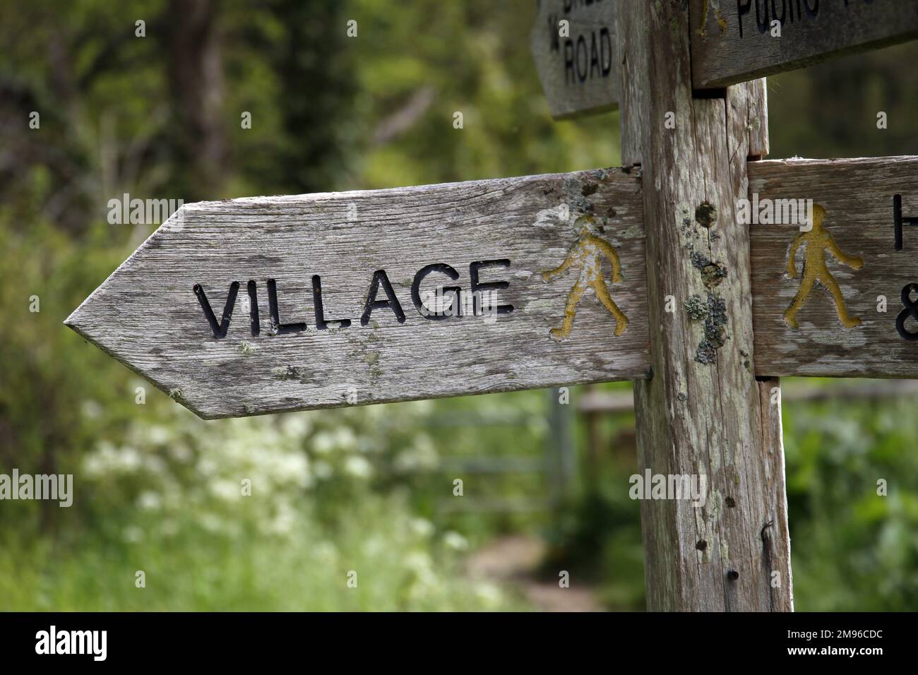 Rustic to the Village Sign Stock Photo
