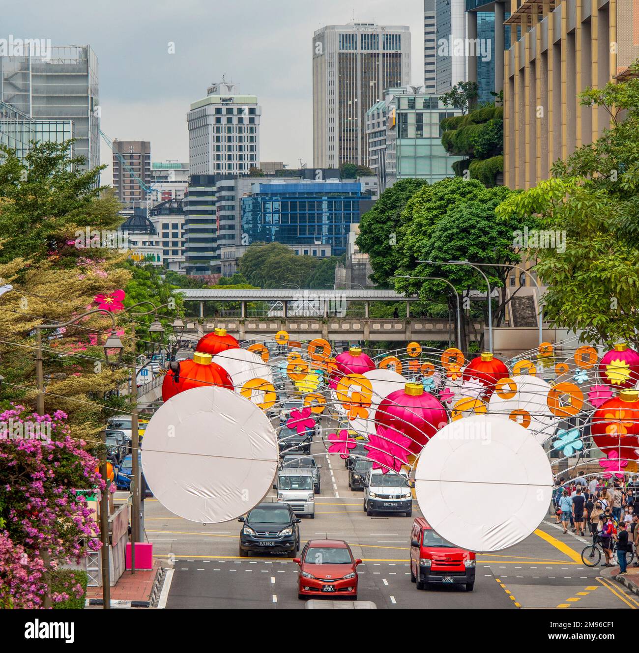 Bouganvillea Singapore Pink and Chinese New Year decorations for Year of the Rabbit over New Bridge Road Chinatown Singapore. Stock Photo