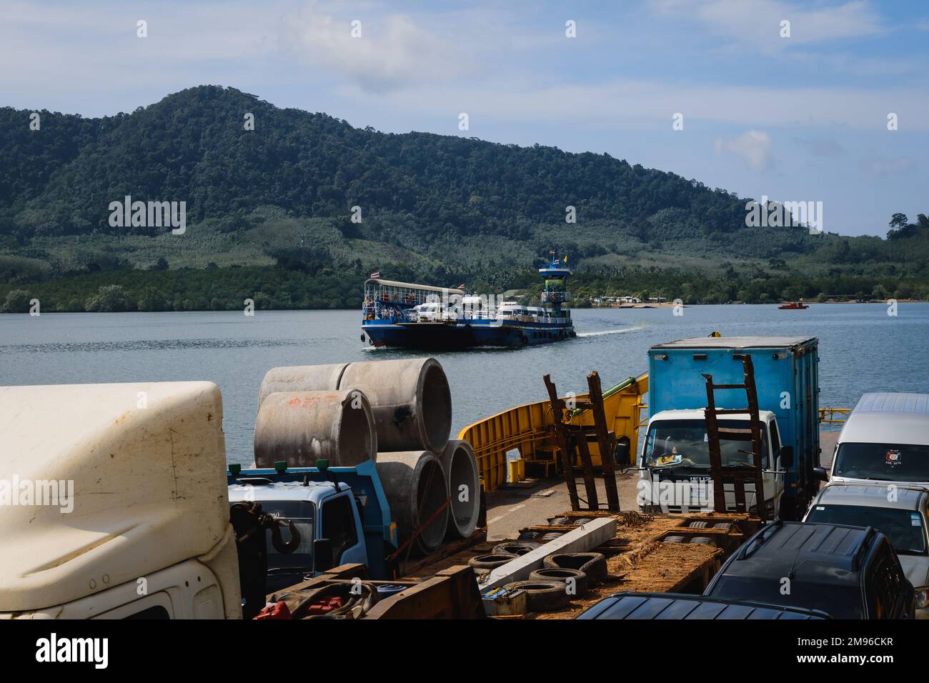 Krabi, Thailand. November 22, 2022. Two ferries heading to Ko Lanta Island in Krabi, Thailand with trucks and cars on board Stock Photo