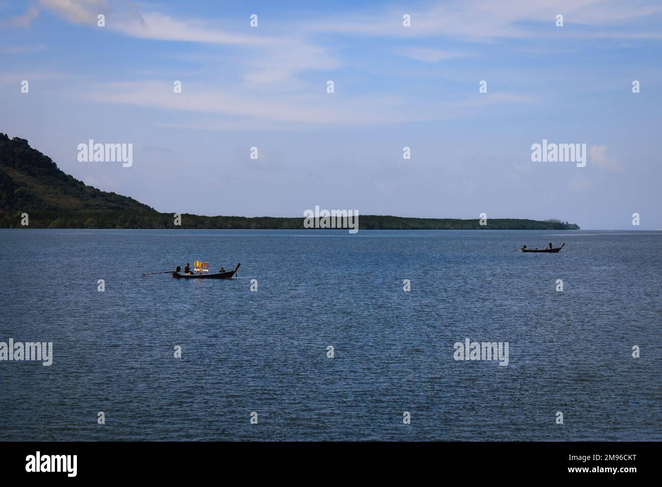 Long-Tail fishing boats on the sea next to Ko Lanta Island in Krabi, Thailand Stock Photo