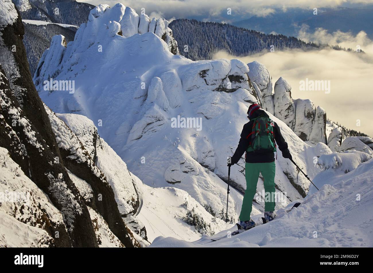 Skier man in safe ski equipment in Ciucas Mountains, Romania Stock Photo