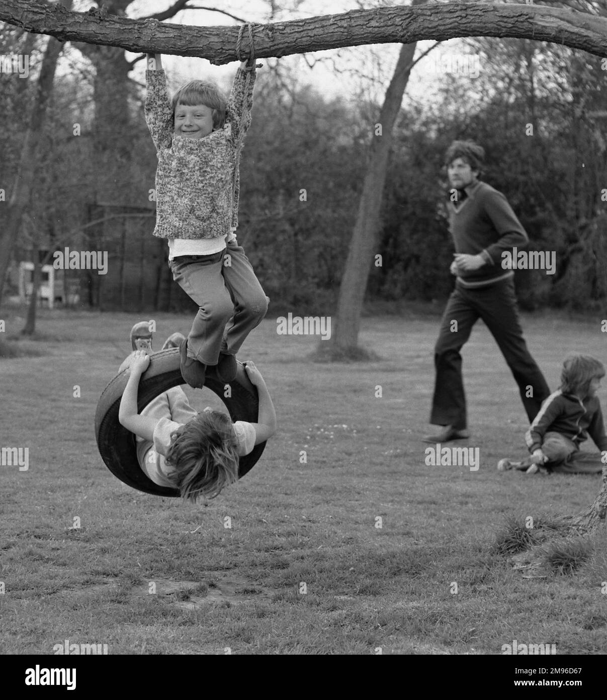 Two Boys Playing On Swing Black And White Stock Photos Images Alamy two-boys-playing-on-swing-black-and-white-stock-photos-images-alamy