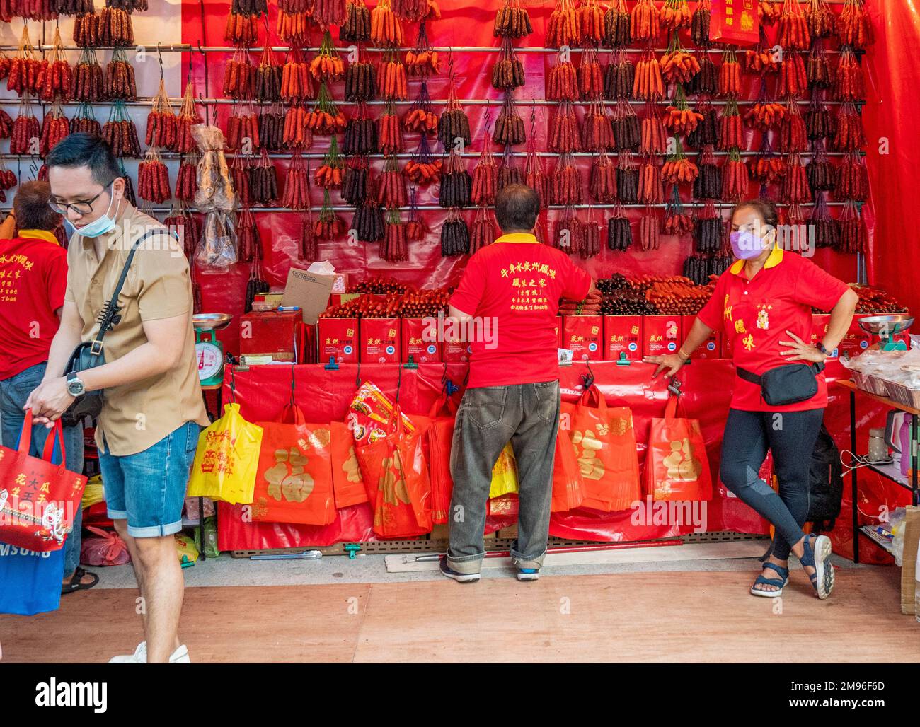 Market stall selling Chinese dried cured sausages for Chinese New Year in Chinatown Singapore. Stock Photo