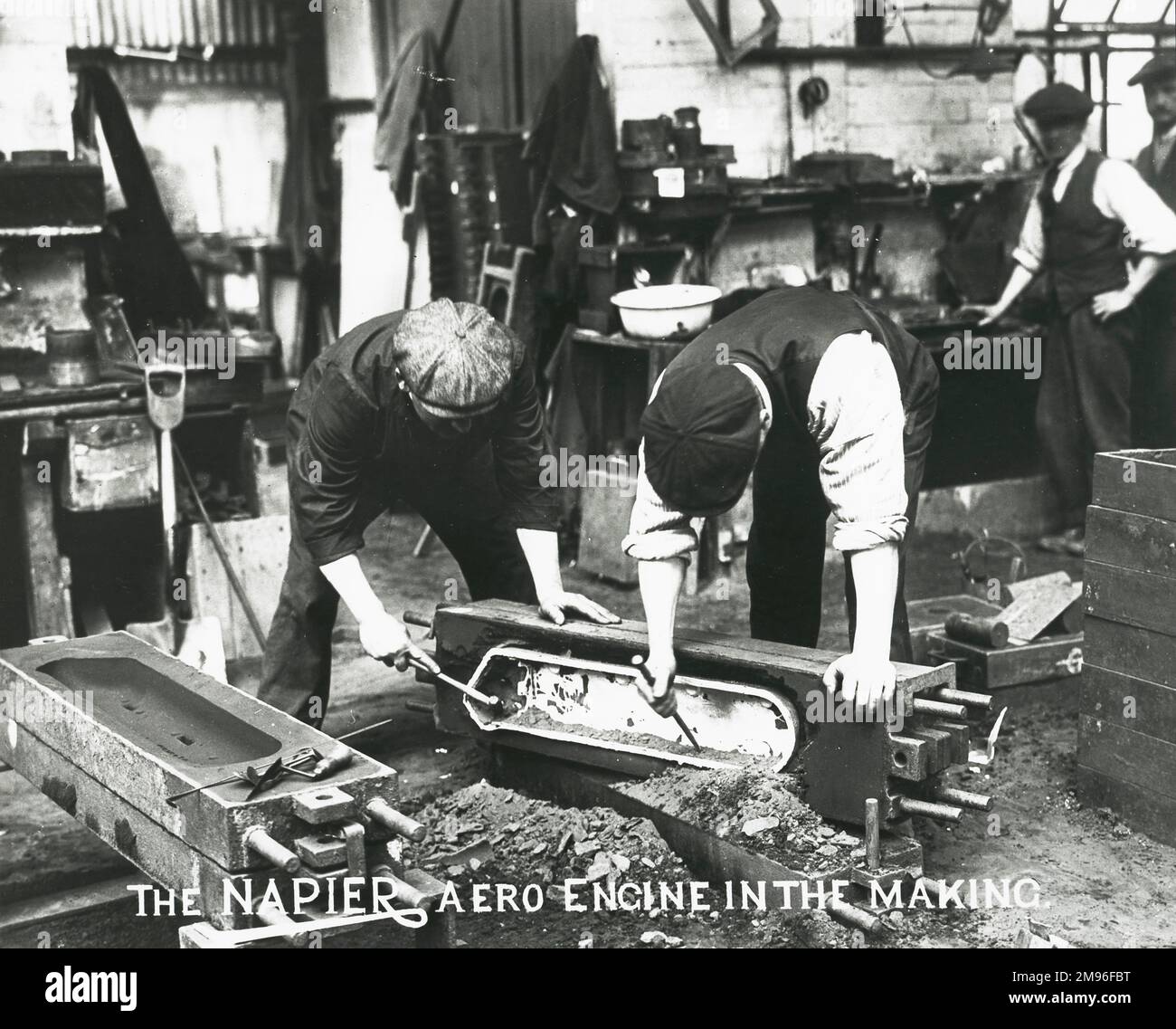 The Napier aero engine in the making  foundry, the solidifed cover is broked out of its mould box Stock Photo