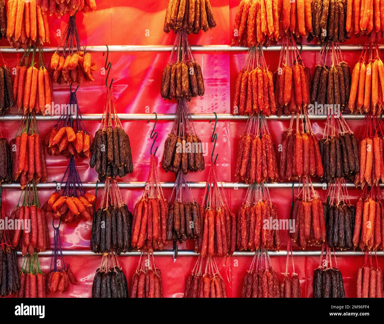 Market stall selling Chinese dried cured sausages for Chinese New Year in Chinatown Singapore. Stock Photo