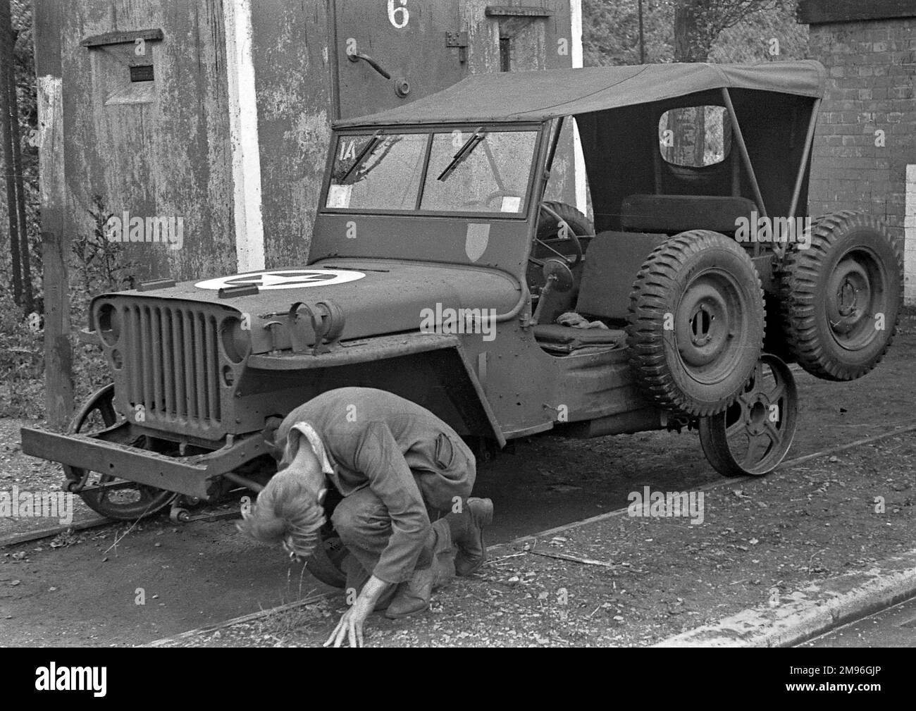 A man repairing a jeep. Stock Photo