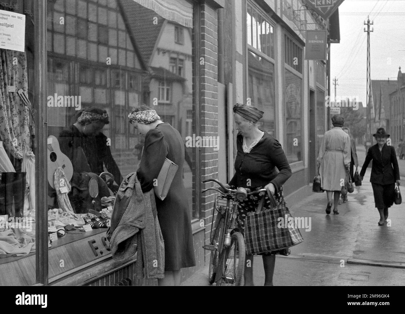 Women looking in a shop window. Stock Photo
