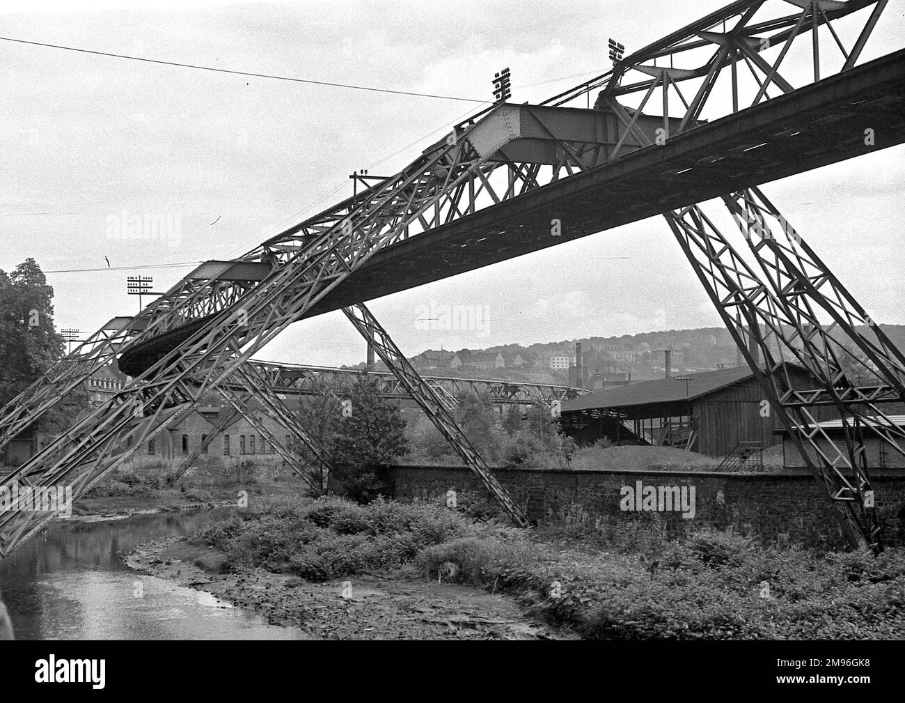 A large metal bridge structure over a river Stock Photo Alamy