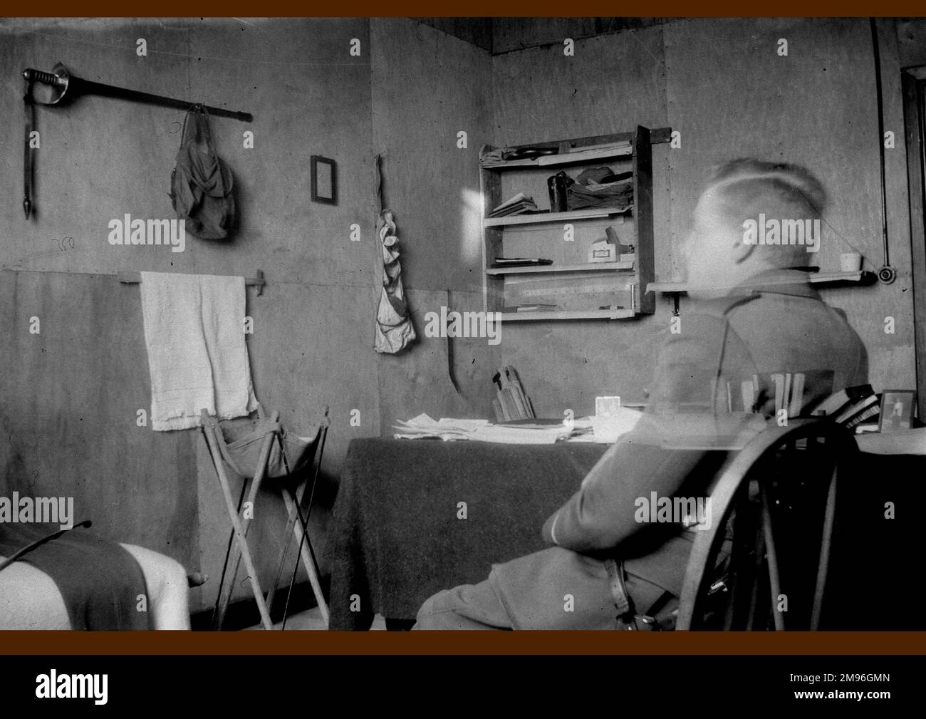 A soldier sitting in a room at the army village of Tidworth, Wiltshire. Stock Photo