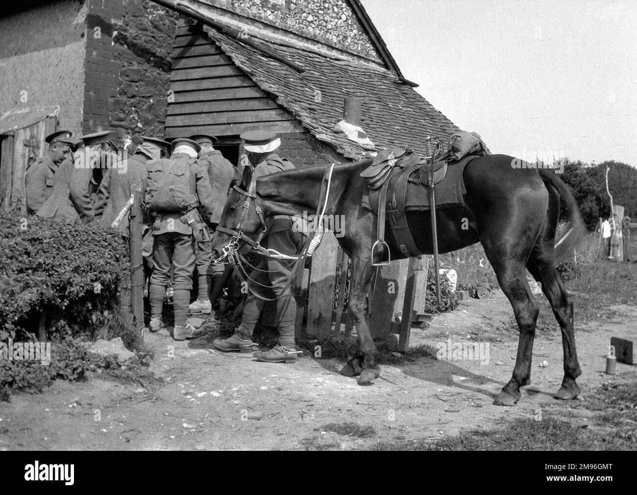 A group of soldiers and a horse at the army village of Tidworth, Wiltshire. Stock Photo