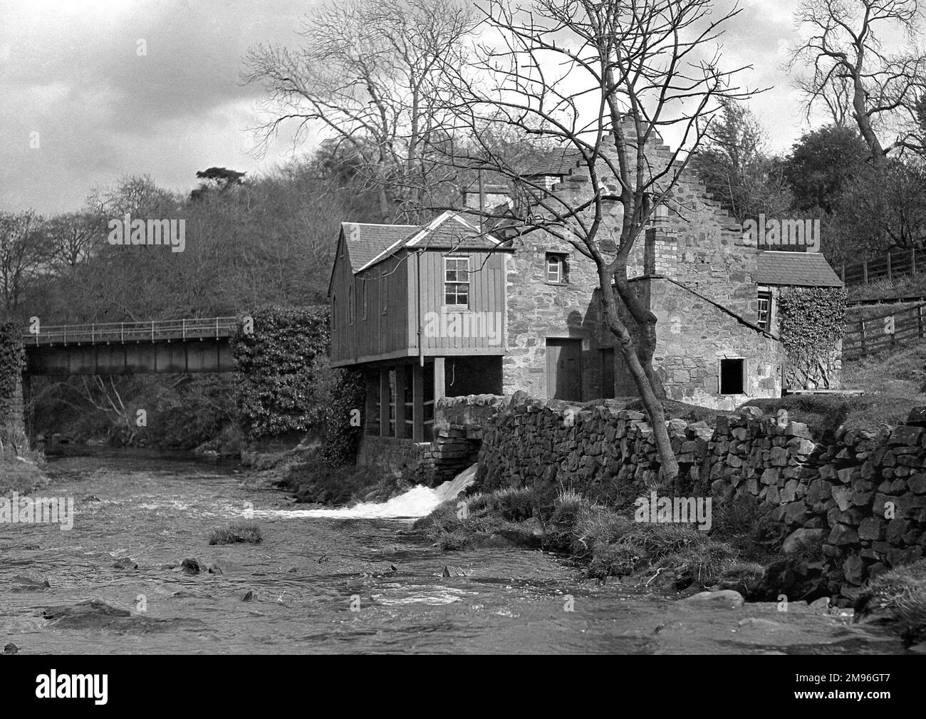 View of a mill at the side of a river stock photo alamy