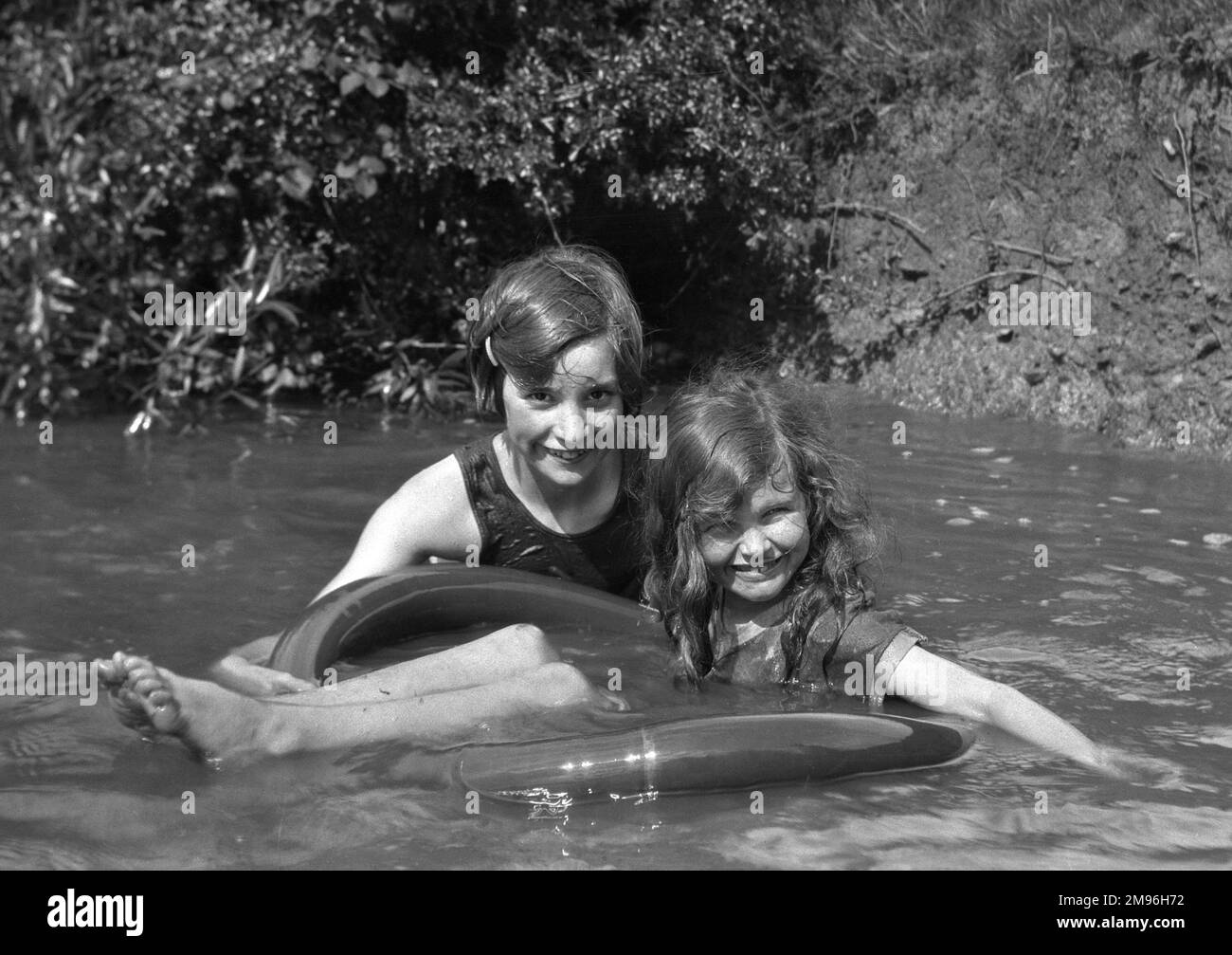 Girls in rubber ring Black and White Stock Photos & Images Alamy