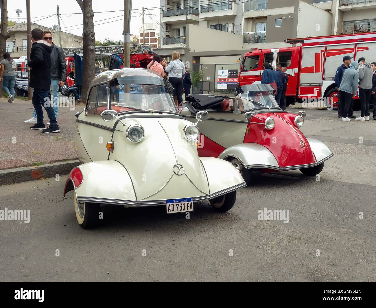 Old classic economy 1950s Messerschmitt KR200 Kabinenroller coupe and KR201 roadster one door three wheel German micro cars parked in the street. Stock Photo