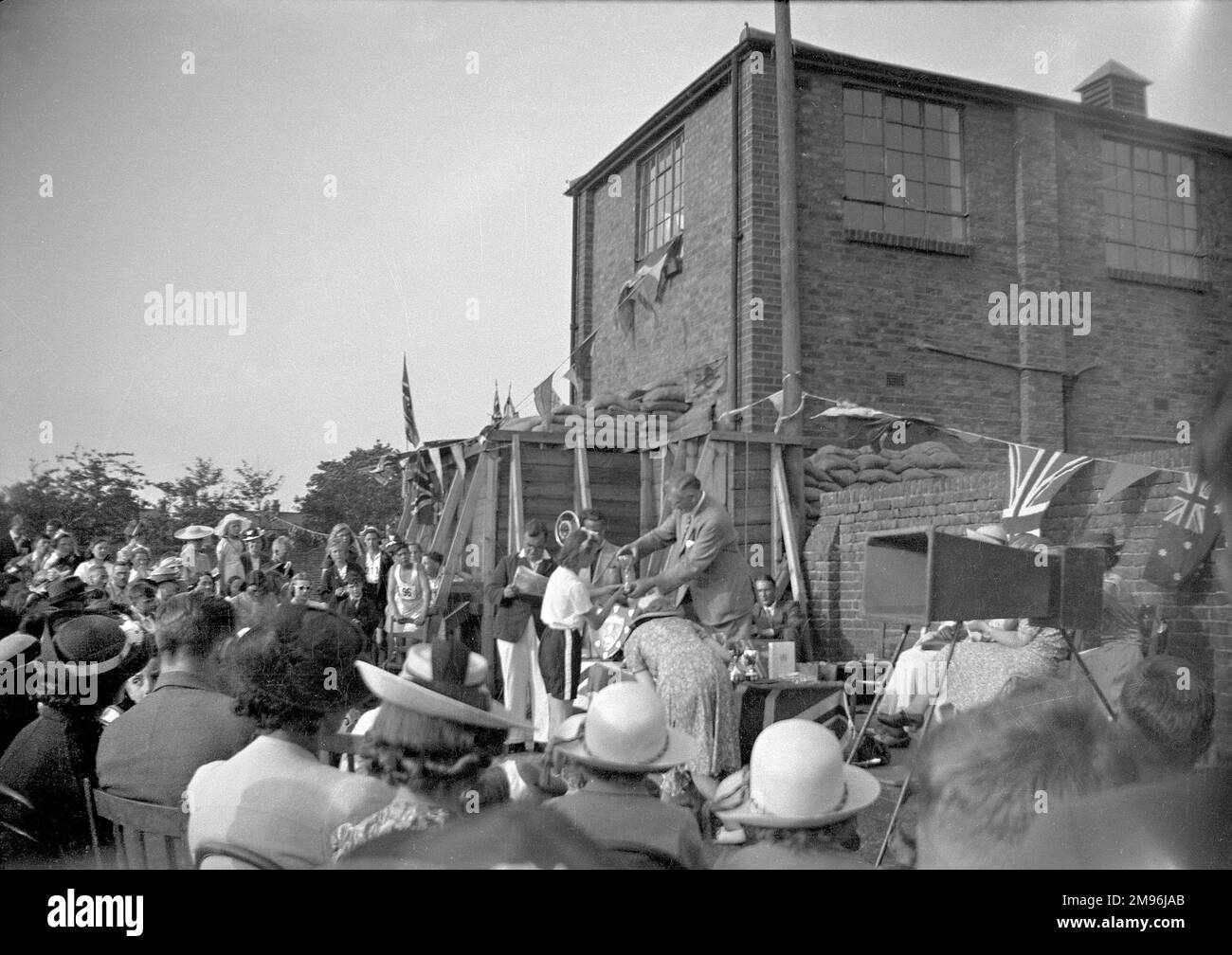 Scene at a sports day prizegiving, with British and Australian flags on display. Stock Photo
