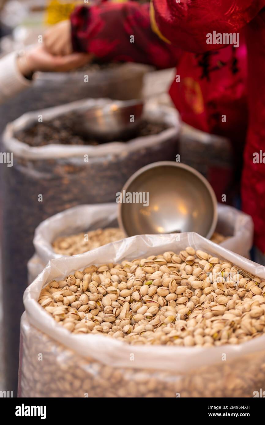 Sacks of pistachios and sunflower seeds on sale at Dihua Street New Year's market in Taipei ahead of the Lunar New Year and the Year of the Rabbit. Stock Photo