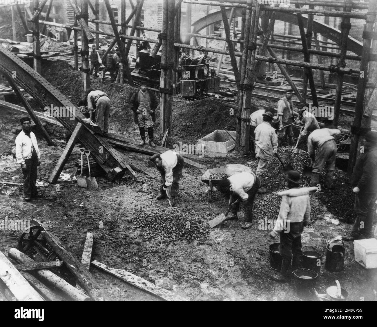 A group of navvies working on an elevated section of an inner London railway. Stock Photo
