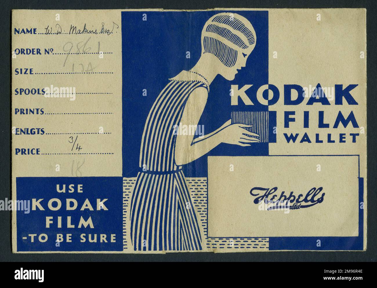 Photographic print wallet, advertising Kodak Film, and the developers, Heppells Ltd.  The art deco design shows a young woman with bobbed hair, taking a photo with a box camera. Stock Photo