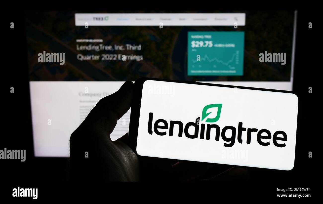 Person holding mobile phone with logo of US lending marketplace company