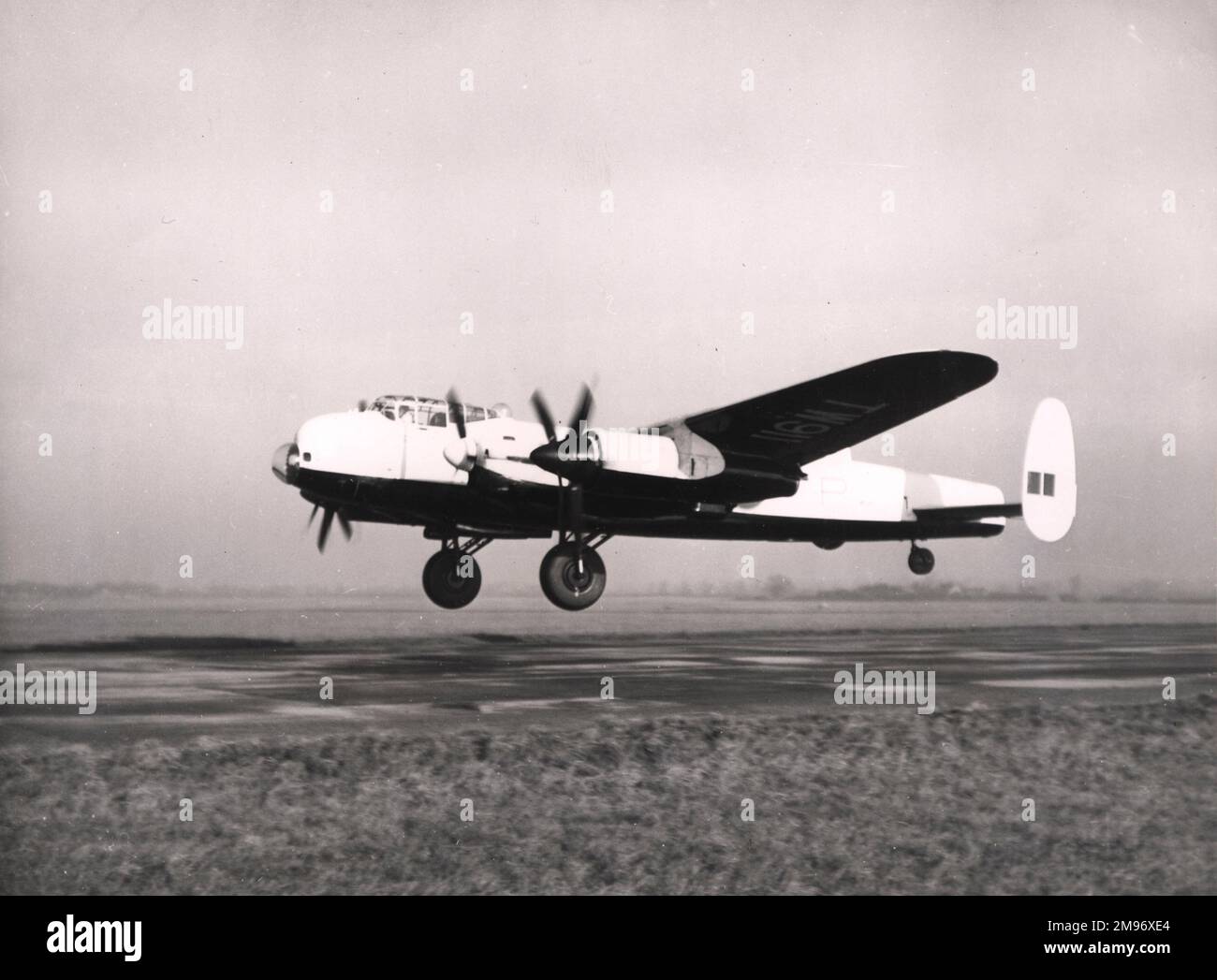 Avro Lancaster III, TW911, just after take off, modified to take two 3,670shp Amstrong Siddeley Python I turboprops in the outboard positions. Stock Photo