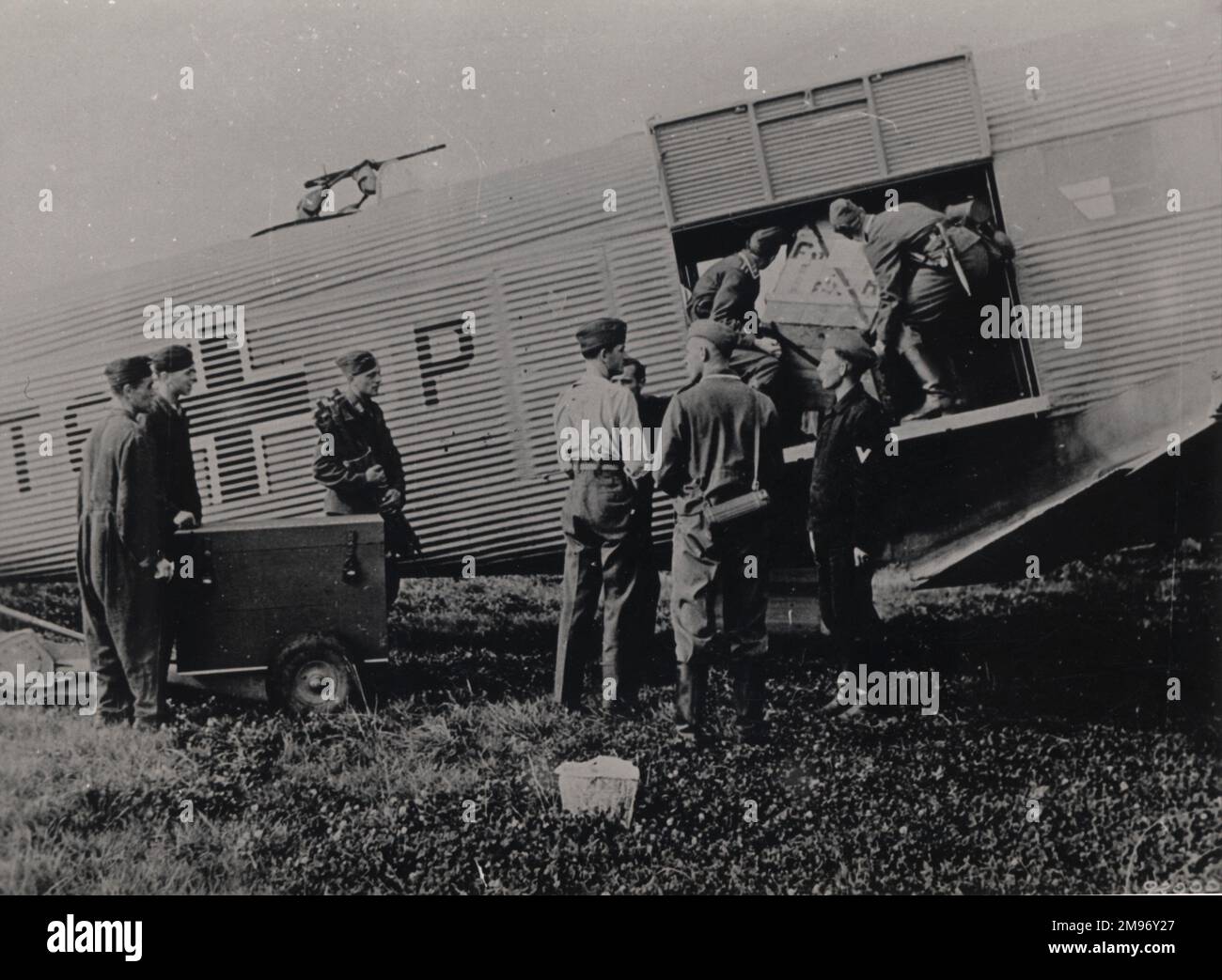 A Luftwaffe Junkers Ju52/3m is loaded with cargo. Stock Photo