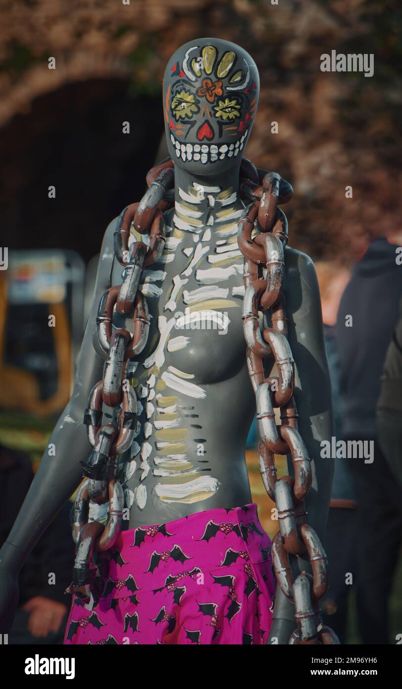Portrait of Creepy looking mannequin painted as skeleton with chain