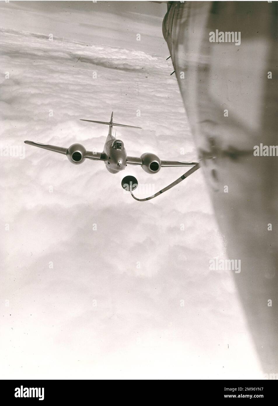 Gloster Meteor about to refuel in flight, from USAF Boeing YKB-29T Superfortress (45-21734), modified from KB-29M configuration with wing-tip probe and drogue refuelling points. Stock Photo