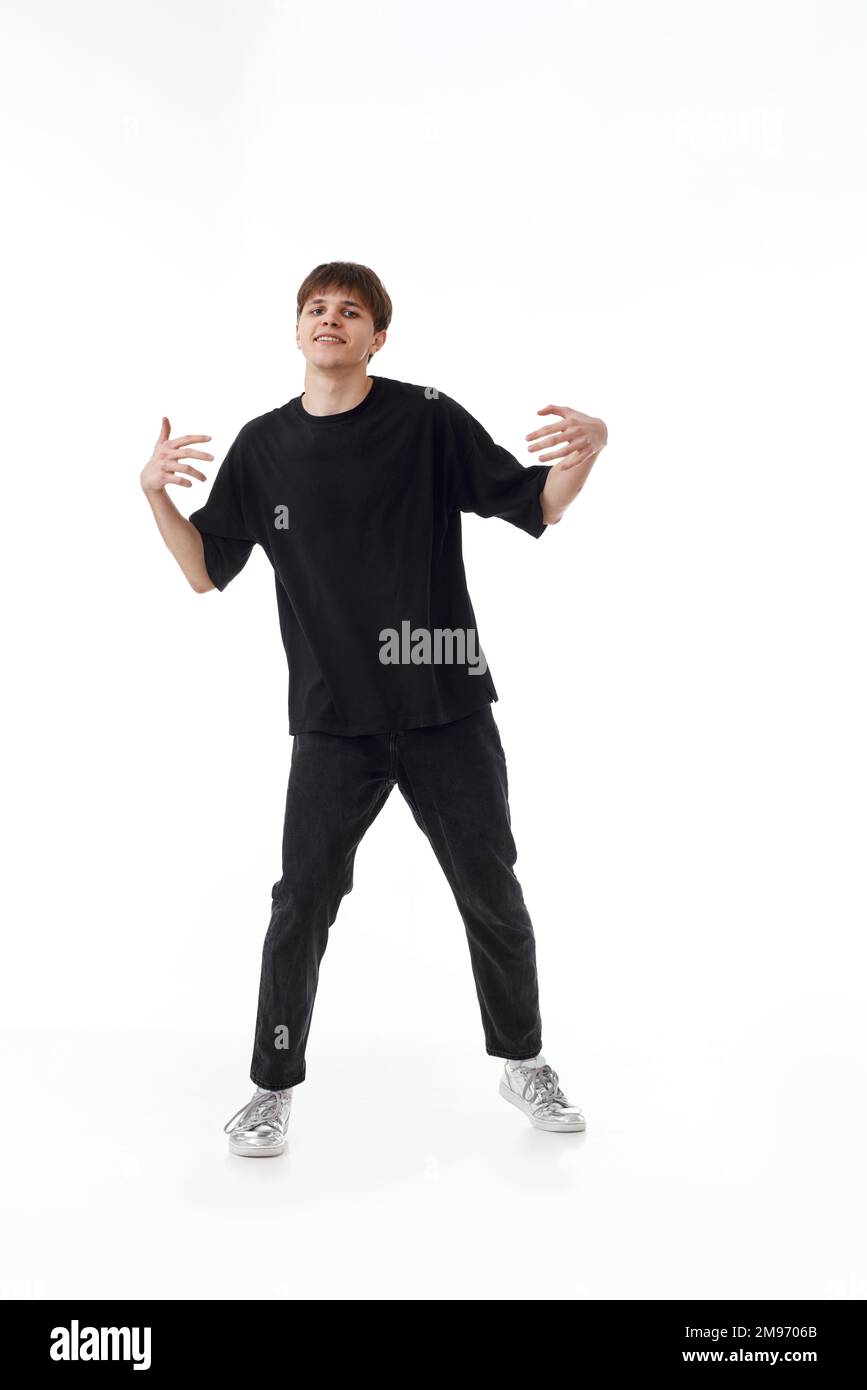 young man in black tshirt and jeans dancing Stock Photo Alamy
