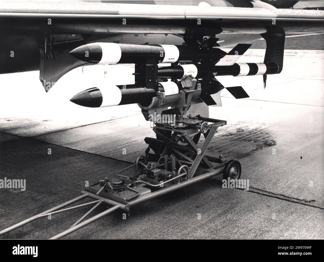 Fairey Fireflash air-to-air missile with its ground handling trolley under the wing of Hawker Hunter 4, XF310. Stock Photo