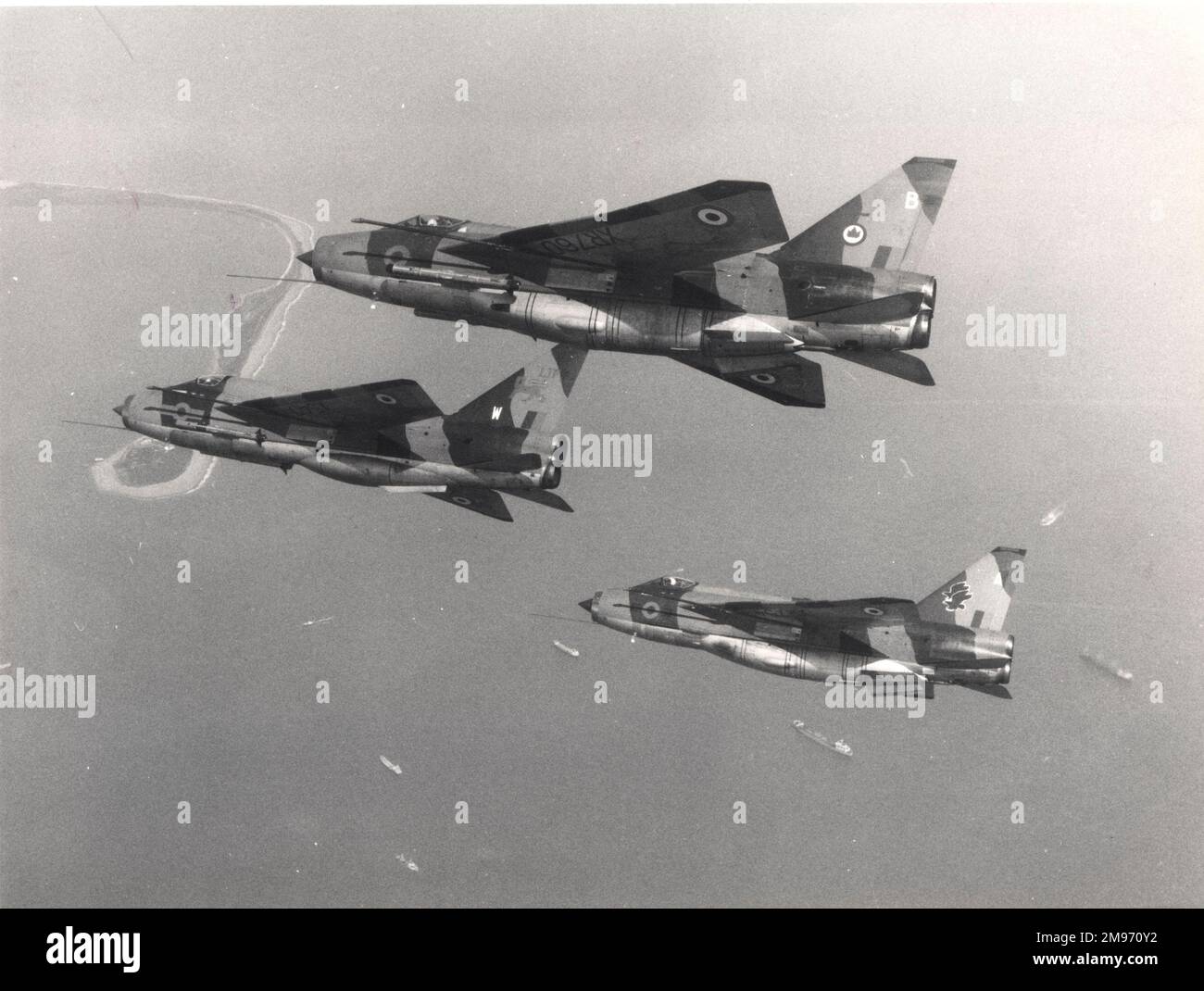 An English Electric Lightning T5 leads two Lightning F6s, all from RAF Binbrook, Lincs. Stock Photo