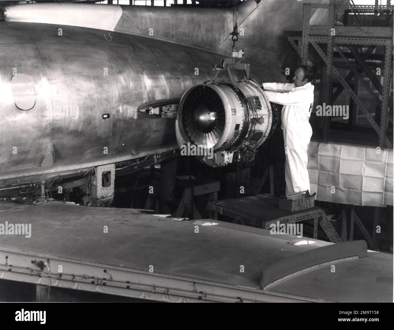 A TFE731-3-1H turbofan is fitted to a British Aerospace 125-700 at Chester. May 1976. Stock Photo