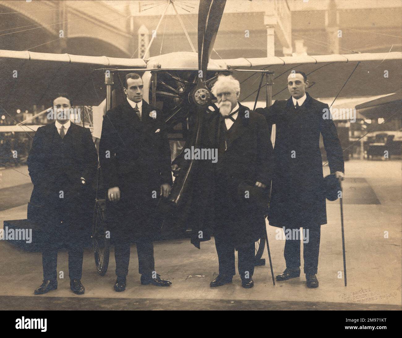 Hendon, London’s first aerodrome, had been largely developed from 1910 by Claude Grahame-White, against the views of the newspaper media who had derided his earlier efforts to develop the airfield through the short-lived Grahame-White, Blériot and Maxim Ltd. Guy Livingston, Sir Hiram Maxim and R.T. Gates are seen with Grahame-White at the 1911 Olympia Aero Exhibition. Stock Photo