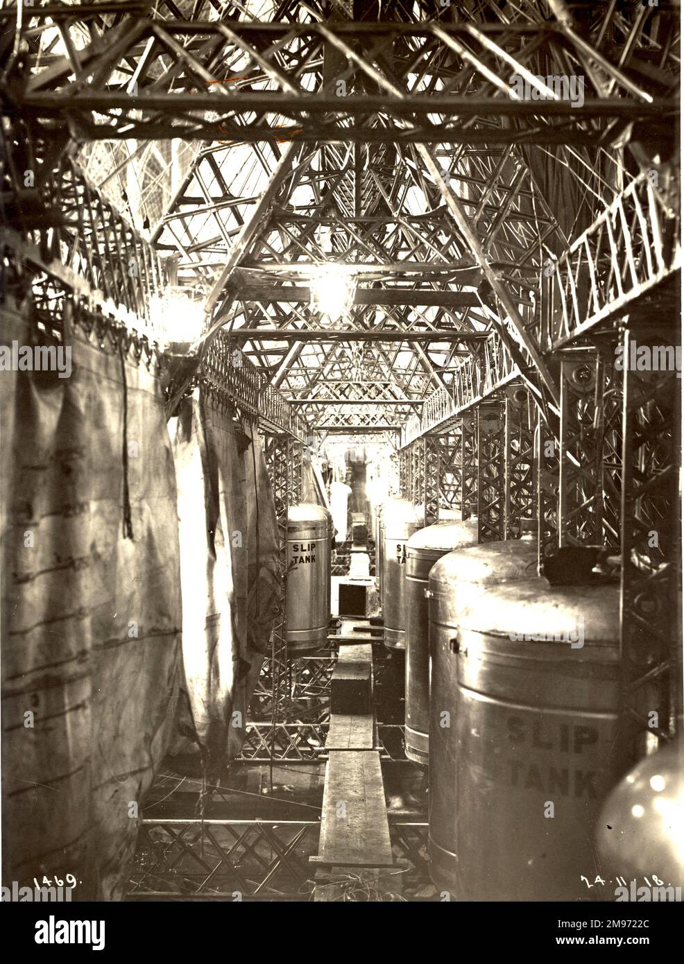 The walking way in the keel of the R34, shown when the airship was still under construction. Some of the aluminium fuel tanks and canvas bags for the water ballast may be seen. 24 November 1918. Stock Photo