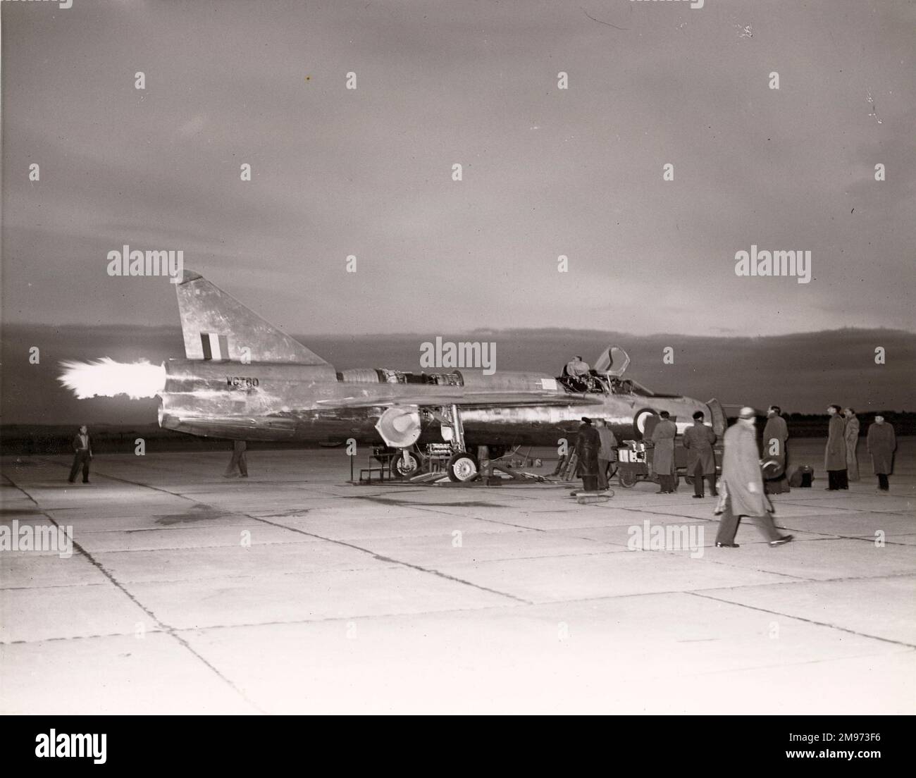 The first engine runs (wet start) of the English Electric P1, WG760, after sunset at Boscombe Down. July 1954. Stock Photo