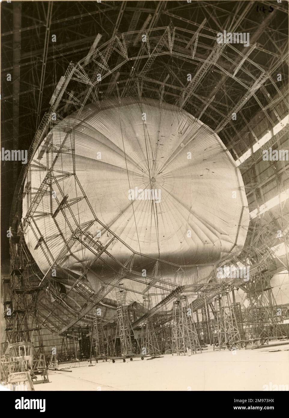 The R101 airship during construction showing the structure and a partially inflated gasbag. Stock Photo