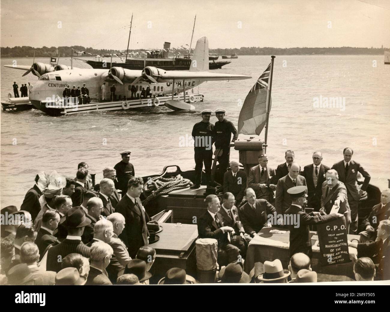 Taking aboard the first Empire Air Mail (Great Britain to South Africa) to be transported by Imperial Airways S23 C-Class flying boat, G-ADVE, Centurion, Southampton, 29 June 1937. [See also 56011102] Stock Photo