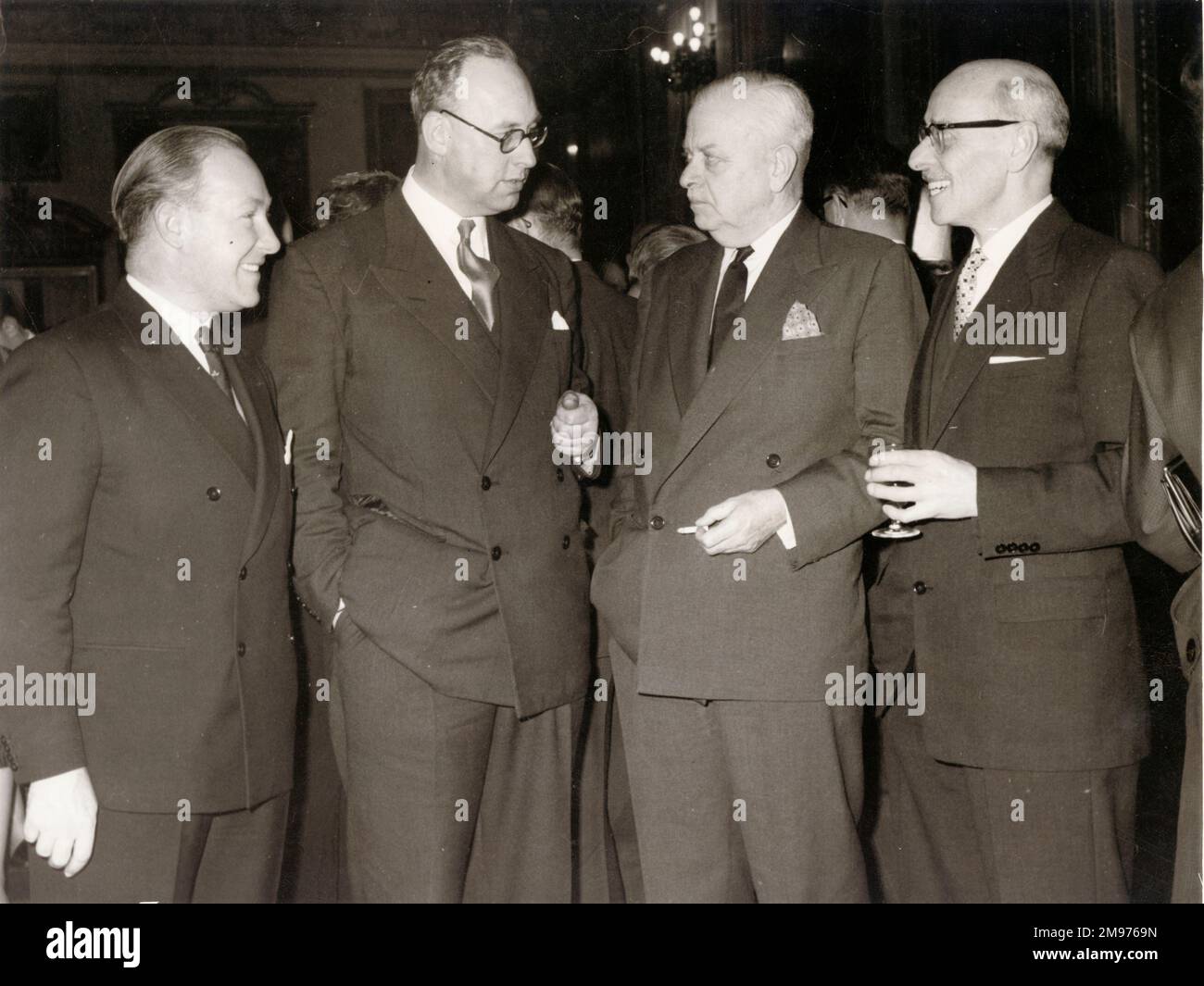 From left: John W.R. Taylor, Peter Masefield, Leonard Bridgeman and H. Sampson at Jane’s 50th anniversary Golden Jubilee party, December 1959. Over the first 80 years of its publishing history Jane’s was edited by just four people - Fred T. Jane (1909-1916), C.G. Grey (1916-1941), Leonard Bridgeman (1941-1959) and John W.R. Taylor (1959-1989). Stock Photo