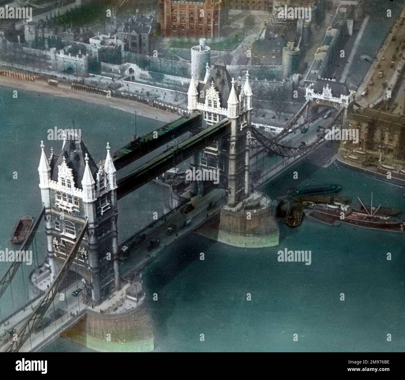 A coloured aerial view of Tower Bridge, London, looking south towards the Tower of London. A Simmonds view. Stock Photo